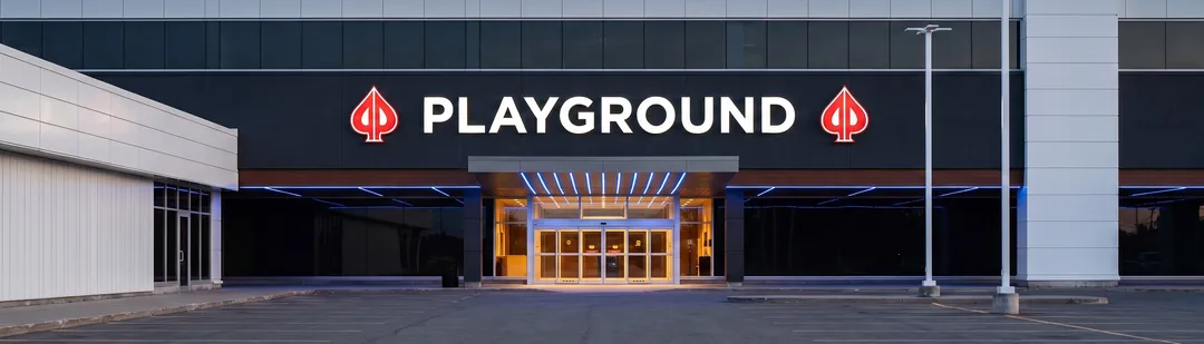 The PLAYGROUND sign above the entrance at dusk