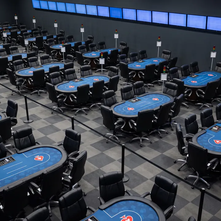 Empty poker tables in the Playground poker room